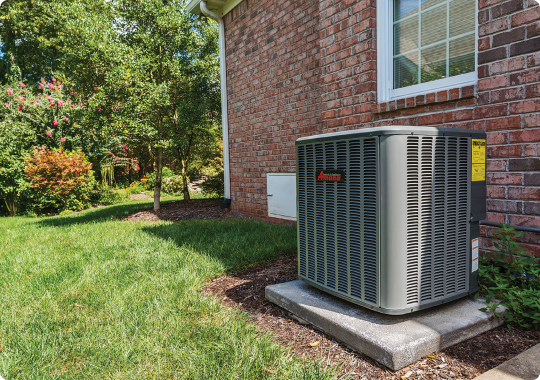 heat-pumps A heat pump outside of a home.